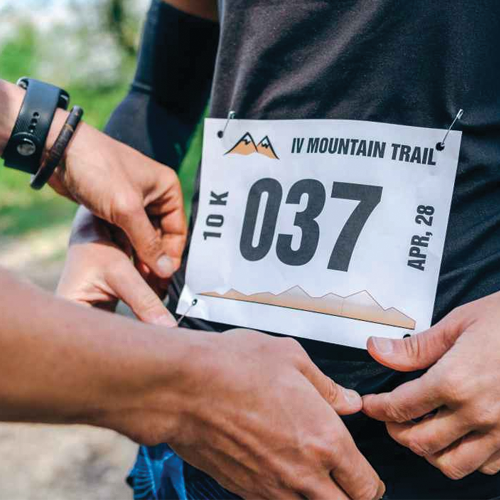 Customized marathon bib with runner's number and sponsor logos.