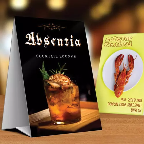 Table tent card showcasing company logo and promotional message.